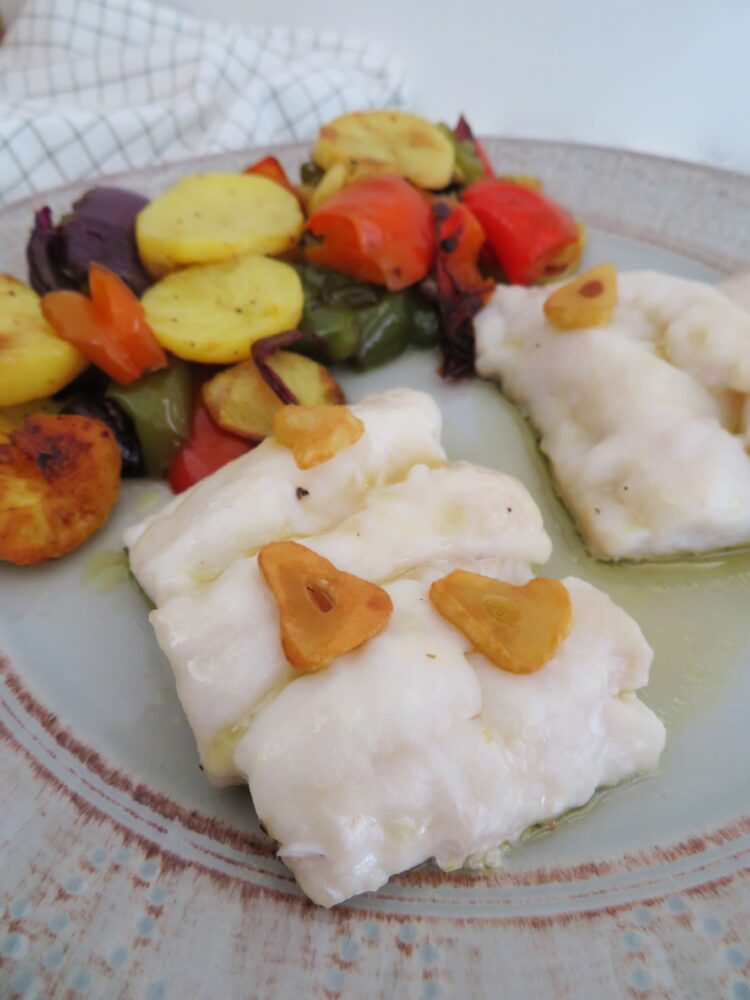 Oven-baked hake with roasted potatoes-rootsandcook