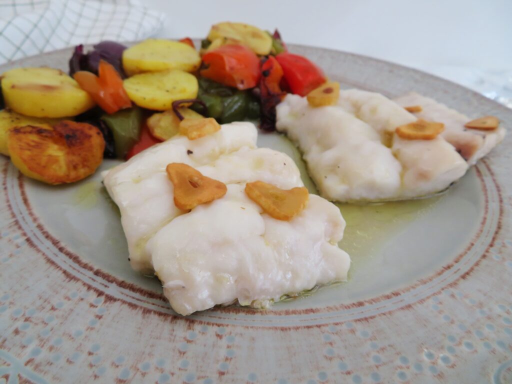 Oven-baked hake with roasted potatoes-rootsandcook