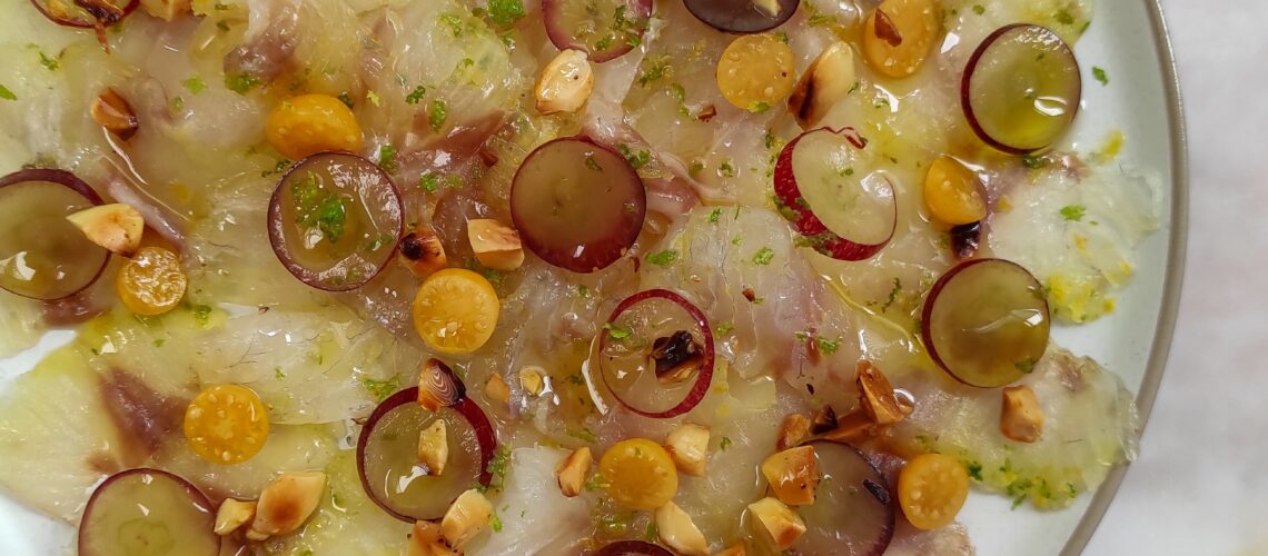 Cured sea bass with almonds and grapes-rootsandcook