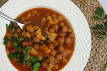 slow cooker chickpea stew with codfish served in a platter -close up view