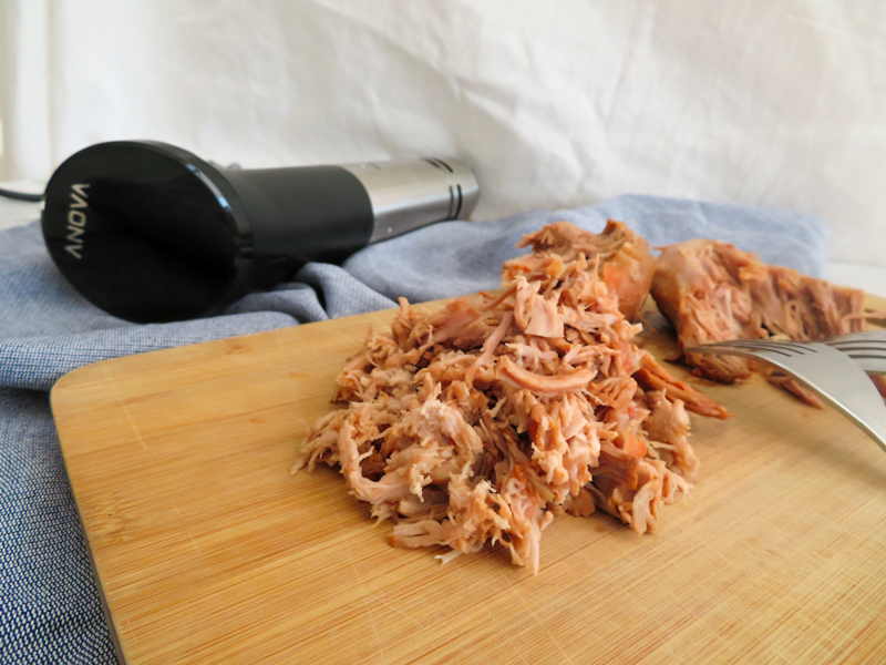 sous vide pulled turkey with the Anova precision cooker on the background