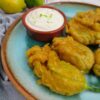 Fried zucchini flowers with curry and lime yogurt