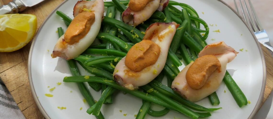 Grilled squid with muhammara and sautéed green beans