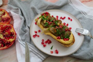 mushroom hummus toast with pomegranate and parsley