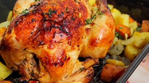 orange and thyme roasted chicken on the slow cooker with roasted vegetables