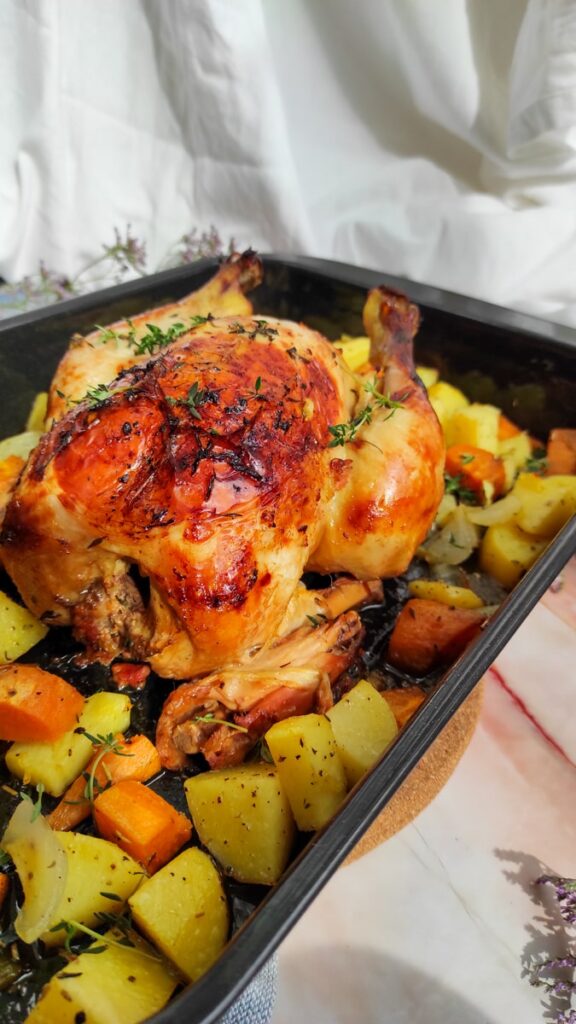 orange and thyme roasted chicken on the slow cooker with roasted vegetables