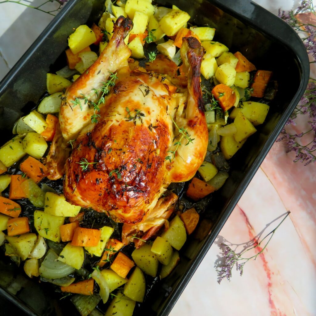orange and thyme roasted chicken on the slow cooker with roasted vegetables